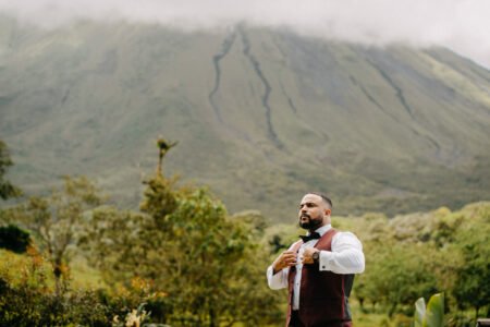 groom with volcano arenal at the back